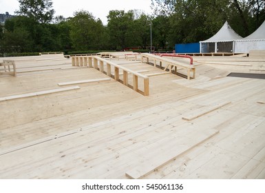 Building New Skatepark Process,assembly,installation Outdoors.Build Skate Park Outside.Grind Rail, Grindbox And Wooden Jump Radius.Wood Construction To Skate On Skateboard,rollerblades,bmx Bike