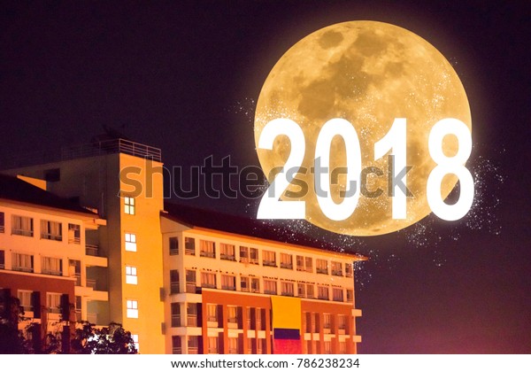 Building in the night with\
super full moon. Using wallpaper or background for happy new year\
2018 image.