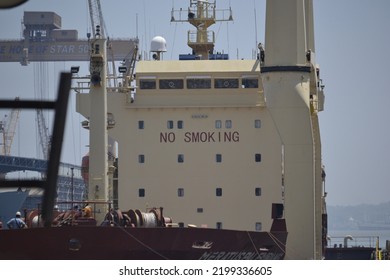 a building on a cruise ship that reads "No Smoking". The boat is docked at the port of Tanjung Perak, Surabaya - Shutterstock ID 2199336605