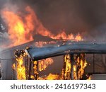 building on fire burning down