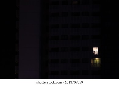 Building With Only One Window Lit During The Night