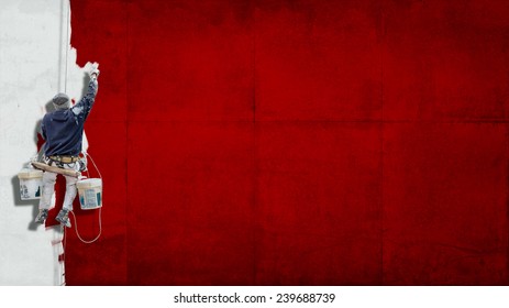 Building Painter Hanging From Harness Painting A Wall In Red With Lots Of Copy Space For Your Own, Message