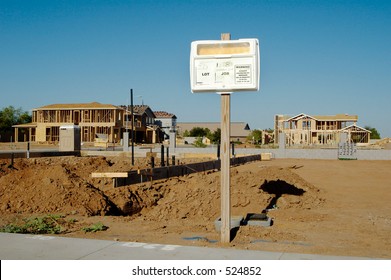 Building permit sign in a residential home construction site.
