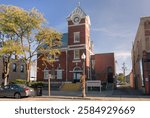 The building of Port Perry Post Office on Queen Street in the town of Port Perry in Ontario, Canada. The structure is a two-storey red brick building with a white dressed-stone foundation and a clock