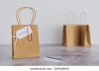 building a recognizable brand conceptual still-life, shopping bag with Branding text on price tag and other plain bags in the background and payment card next to it shot at shallow depth of field - Shutterstock ID 1559160215