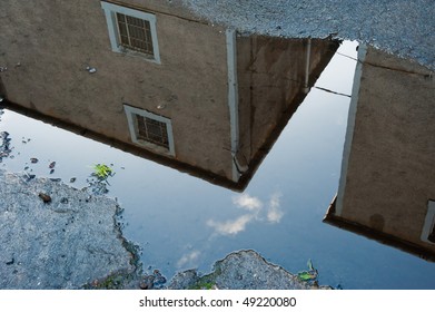Building reflected in water