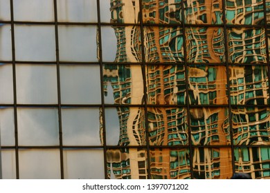Building reflecting in a window