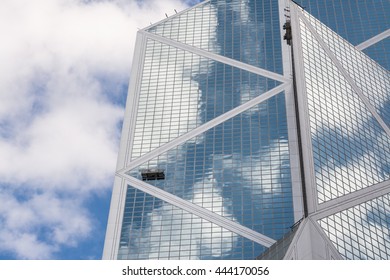 Building reflection. Tower and cloudy sky. 