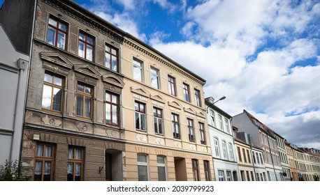 Building renovation: Renovated next to unrenovated old building in the historic old town of Wismar, Mecklenburg-Western Pomerania, Germany - Shutterstock ID 2039799923