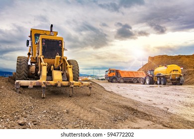 Building a road. Auxiliary machinery for construction - Shutterstock ID 594772202