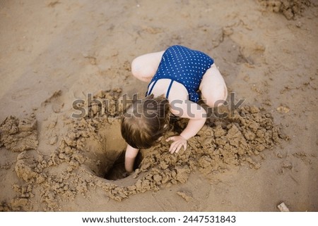 Similar – Foto Bild Baby spielt am Strand.