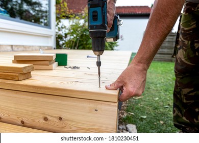 Building Site - Laying Larch Floorboards On A Terrace. Installing Of Siberian Larch Flooring.