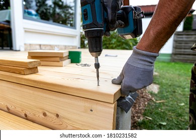 Building Site - Laying Larch Floorboards On A Terrace. Installing Of Siberian Larch Flooring.