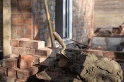 Building Site: Trowel, Bricks And Mortar For Brickwork, Part Of A Renovation Of An Edwardian Suburban House In North London, UK