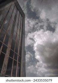 Building and sky full of clouds