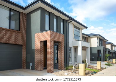 Building of some residential townhouses in a suburb of Australia. The exteriors of some two-story modern Australian suburban homes.