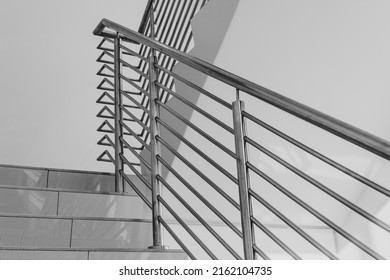 Building Steps With Stainless Steel Hand Rail For Public Safety Close-up Decor Design.