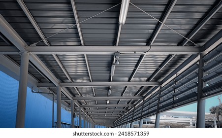 building structure Black steel pipe and H-beam steel,Structure building of steel structure roof truss frame installation Inside the city walkway bridge in thailand - Powered by Shutterstock