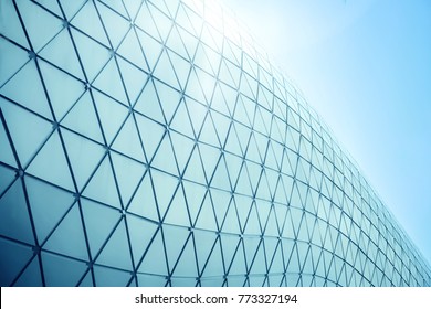 Building structures aluminum triangle geometry on facade of modern urban architecture - Powered by Shutterstock