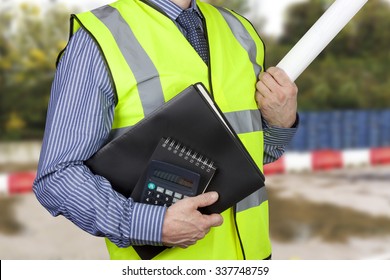 Building Surveyor In Hi Vis Carrying Work Folders And Calculator