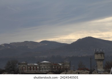 A building with a tower in the background