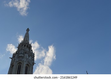 Building Tower Church Spire Against A Blue Sky