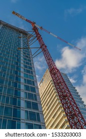 Building under construction, blue sky on background.