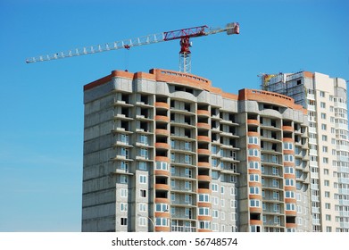 building under construction with lifting crane