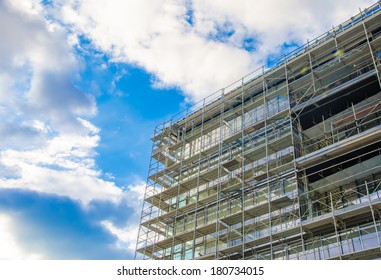 Building Under Construction On A Blue Sky Sunny Day