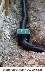 Building an Underground French Drain System after Digging the trench system to keep water away from home's foundation.