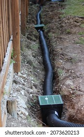 Building an Underground French Drain System after Digging a trench system to keep water away from home's foundation. Protecting Home’s Foundation from Water Damage 