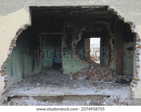 Building, warzone and destruction of a home during military conflict or turmoil during battle. Hole, damage and wall of a housing structure on a battlefield in Israel or Palestine during war Zdjęcia stock © 