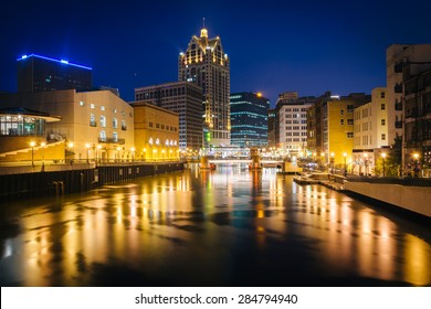 Buildings along the Milwaukee River at night, in Milwaukee, Wisconsin.