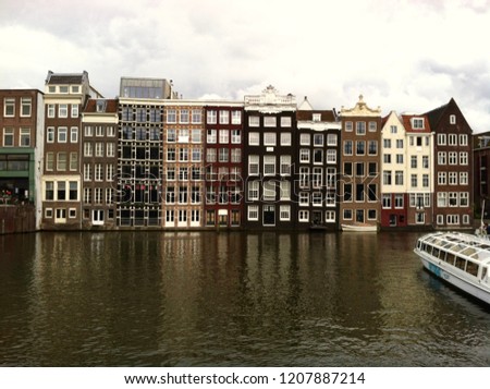 Similar – Image, Stock Photo Tranquil Amsterdam canal with iconic narrow houses