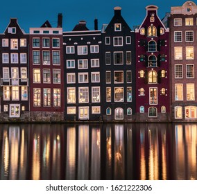 Buildings In Amsterdam Damrak At Night