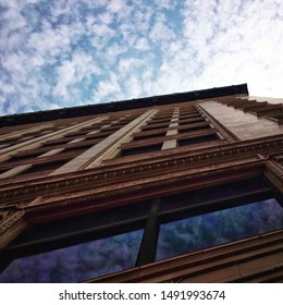 Buildings, architecture, looking up and clouds.