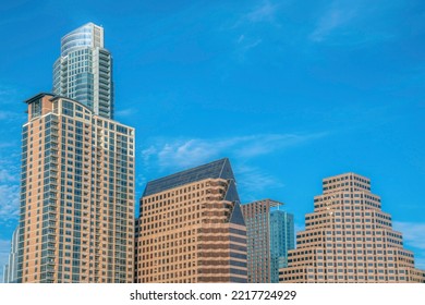 Buildings In Austin Texas Exhibiting Various Shapes Against The Blue Sky. Apartments Or Commercial Units In The City Forming The Skyline Viewed On This Sunny Day.