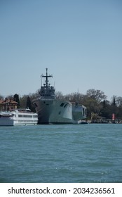 Buildings, Boats And The Anchored Military Ship Near Canals In Venice,Italy, 2019