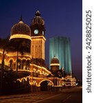 Buildings in merdaka square illuminated at night, with sultan abdul samad building dating from 1894, kuala lumpur, malaysia, asia