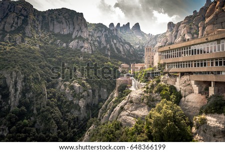 Buildings of Montserrat monastery located between huge rocks in Catalonia, Spain