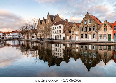 Buildings with reflections  around channels in Bruges at sunset, Belgium