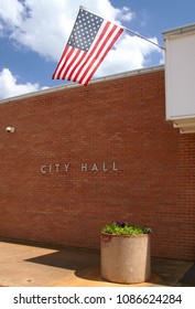 Buildings In Small Town - City Hall With American Flag