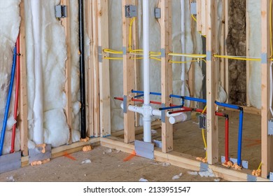 Buildt New Home Construction Featuring Hot And Cold Water PEX Plastic Plumbing Tubes In Bathroom Unfinished