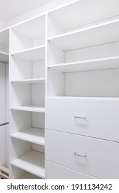 Built In Shelving Inside A Walk In Closet For Organization