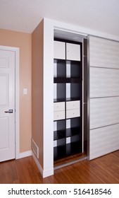 Built-in Closet With Sliding Door Shelving Storage Organization Solution, Empty Shelves