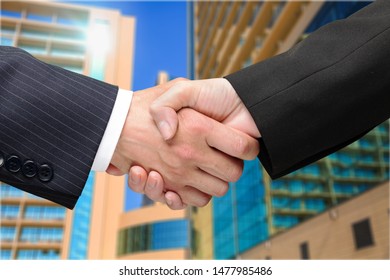 Buisness Human Handshake On Building Background