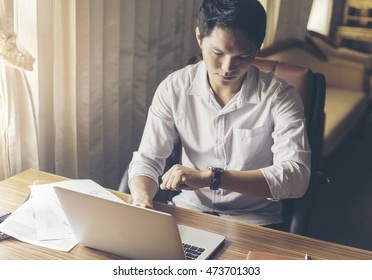 Buisness Man Looking Watch And Work With Notebook