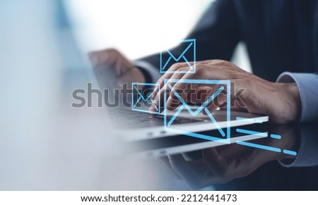 Buisness man using working on laptop computer sending electronic mail with email icon on virtual screen, Email marketing concept