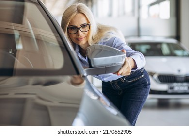 Buisness Woman Choosing A Car In A Car Showroom