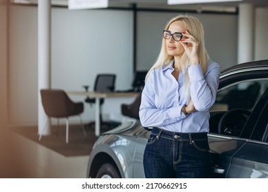 Buisness Woman Choosing A Car In A Car Showroom